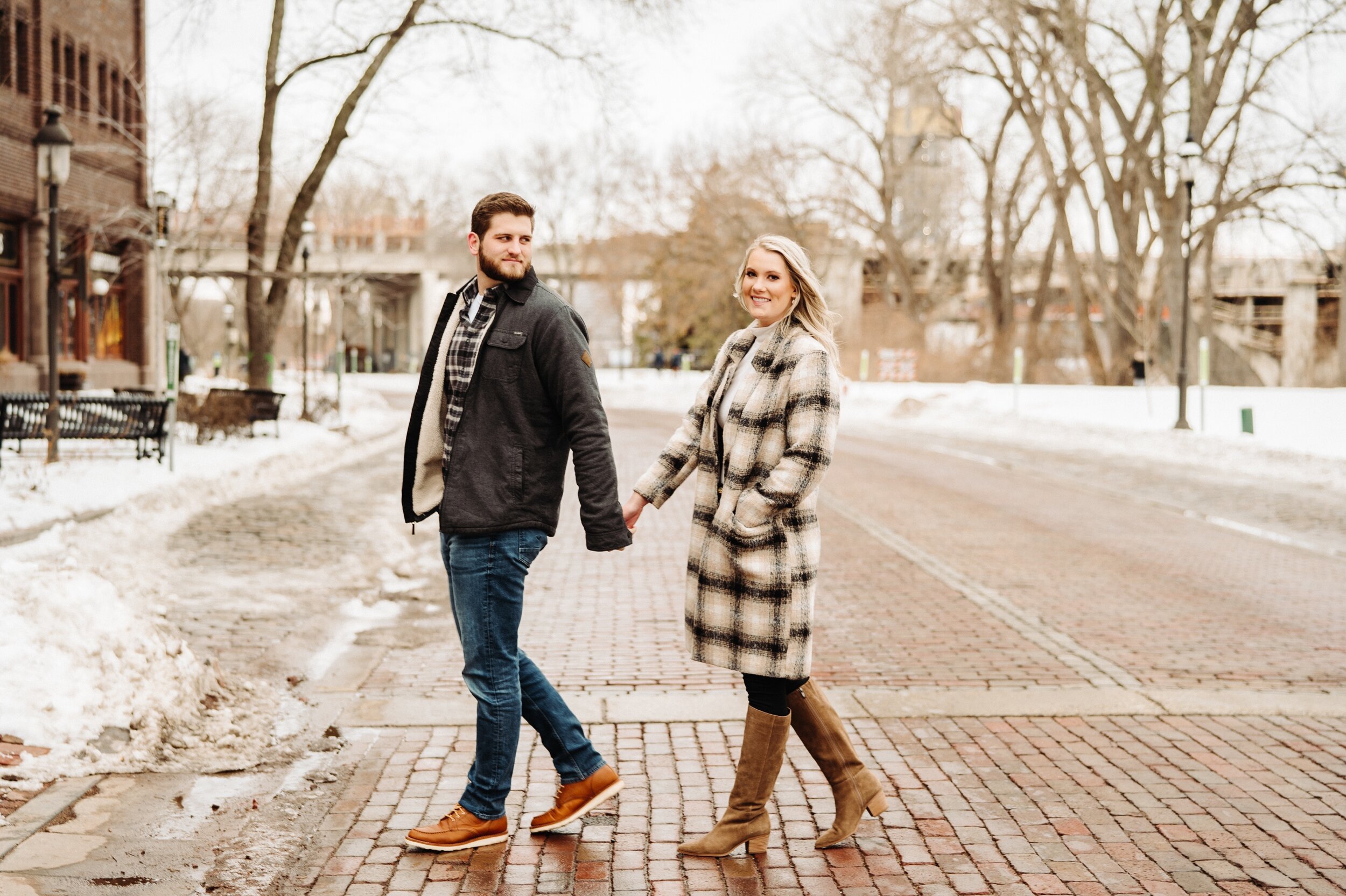 09_minneapolis-engagement-photos-st-anthony-main-22_Winter Minneapolis engagement session at st Anthony main. .jpg